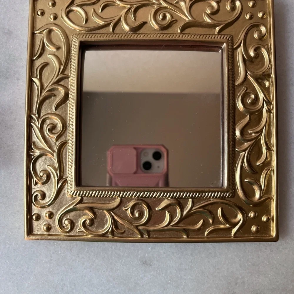 Vintage ornate gold wall mirror, accent mirror. Bow decorated frame